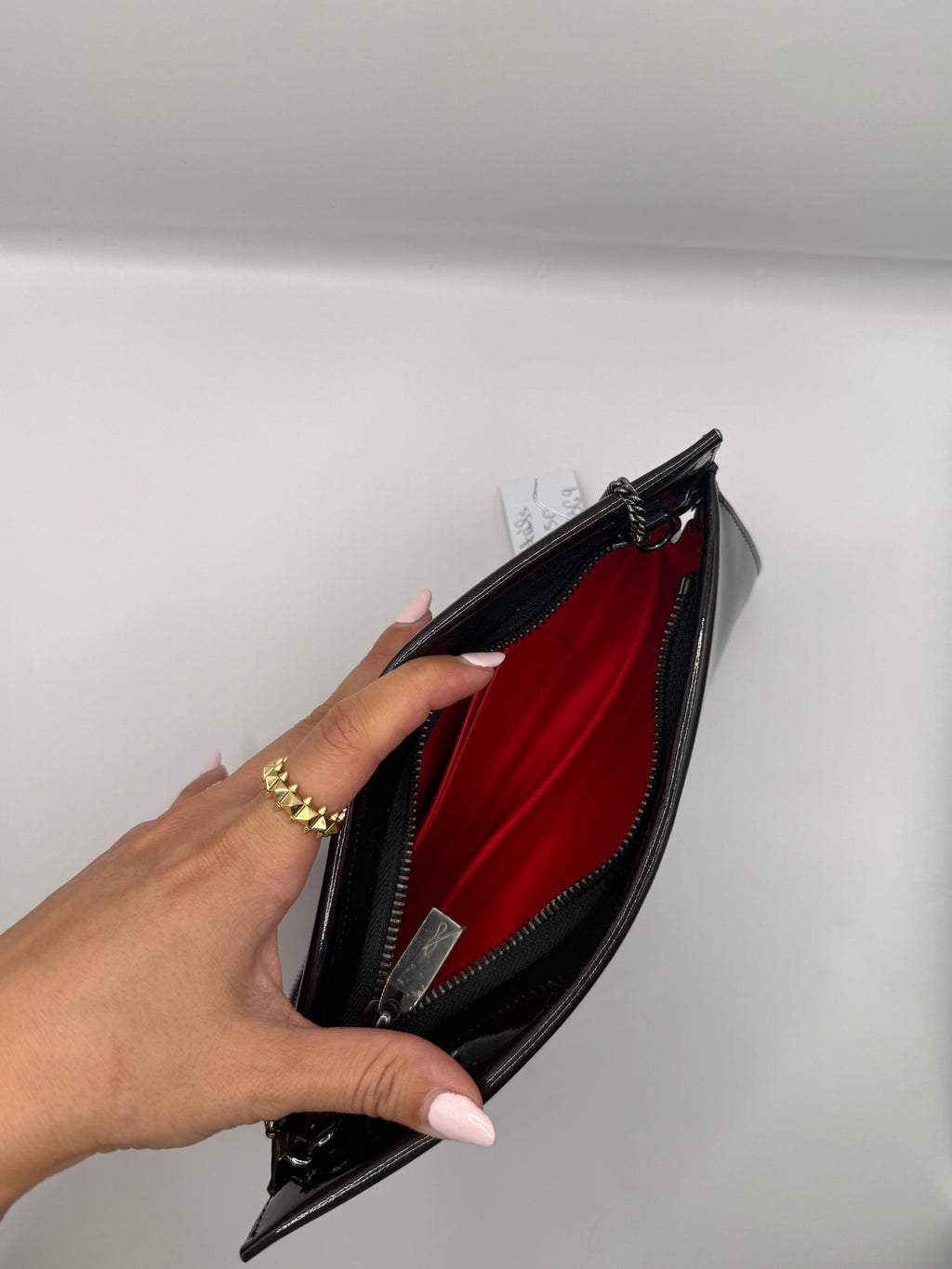 Christian Louboutin Loubitwist Patent leather small clutch