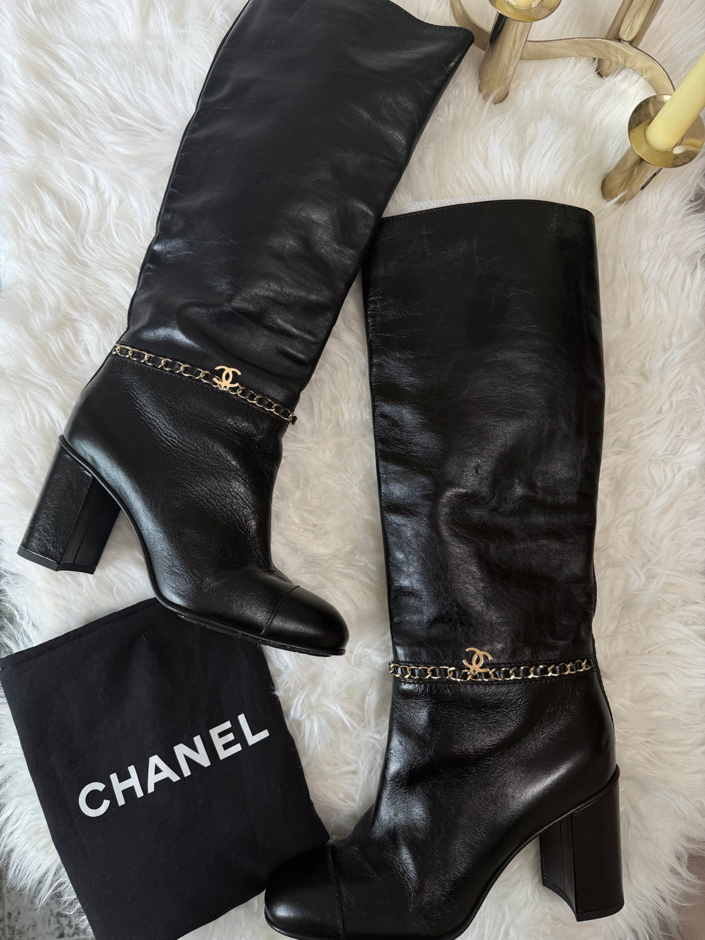 Chanel leather tall boots with a gold CC chain detail and block heel