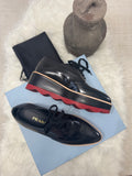 PRADA WINGTIP PLATFORM PATENT LEATHER DERBY SHOES