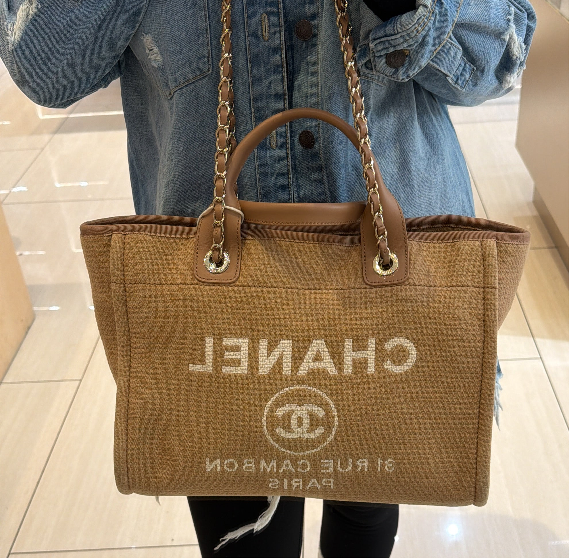 Chanel Medium Deauville tote bag in mixed fibers with gold-tone chain and leather handles