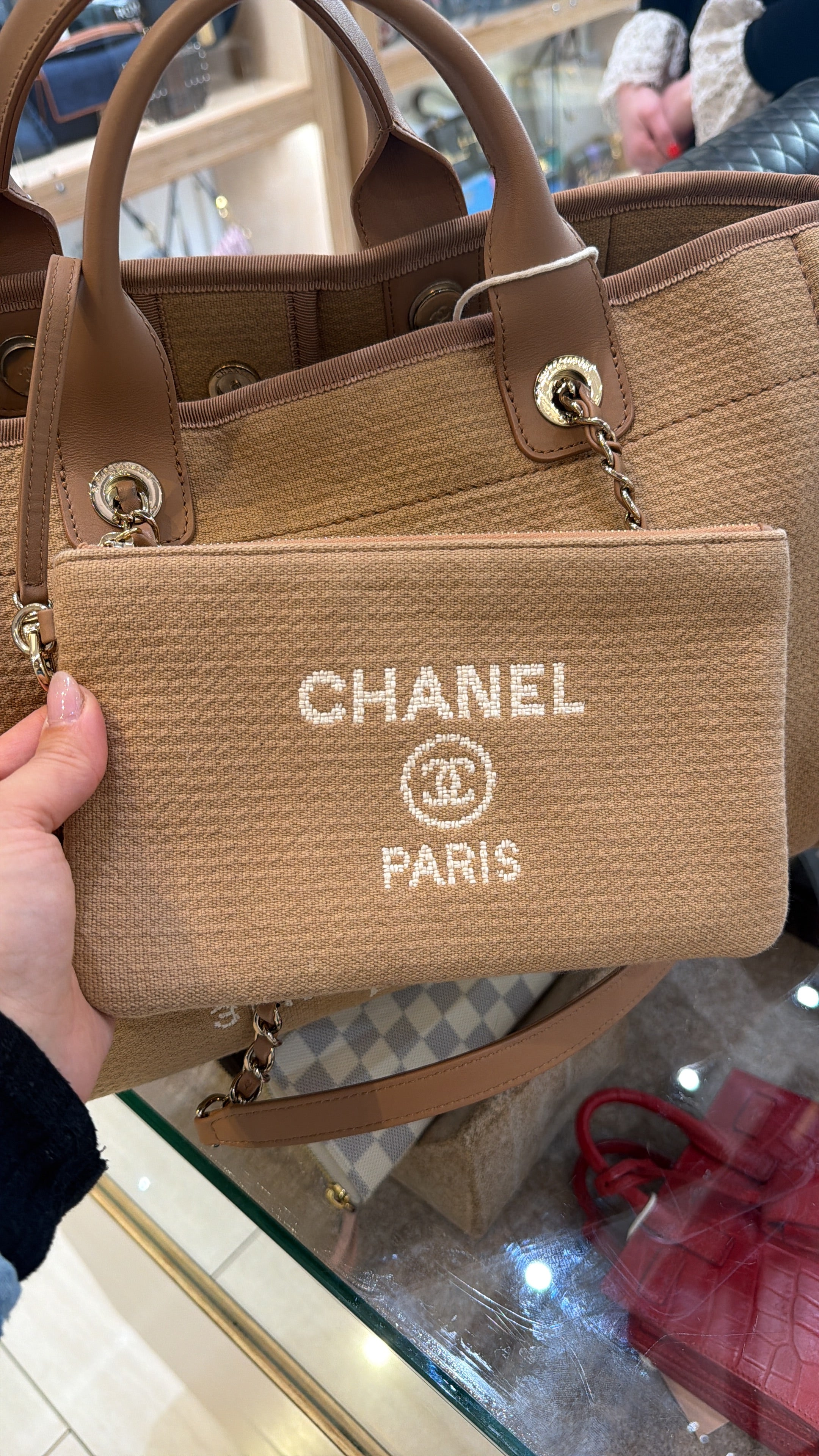 Chanel Medium Deauville tote bag in mixed fibers with gold-tone chain and leather handles