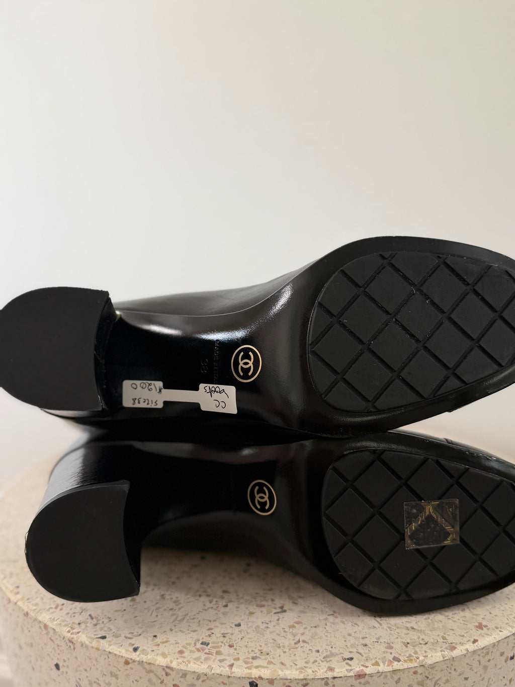 Chanel leather tall boots with a gold CC chain detail and block heel