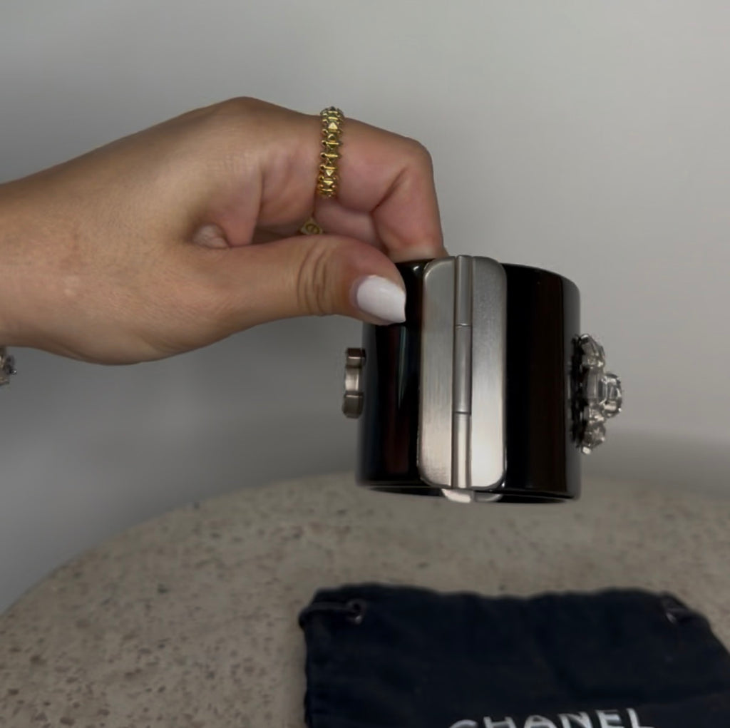 CHANEL BLACK RESIN AND CRYSTAL MOTIF WIDE CUFF BRACELET