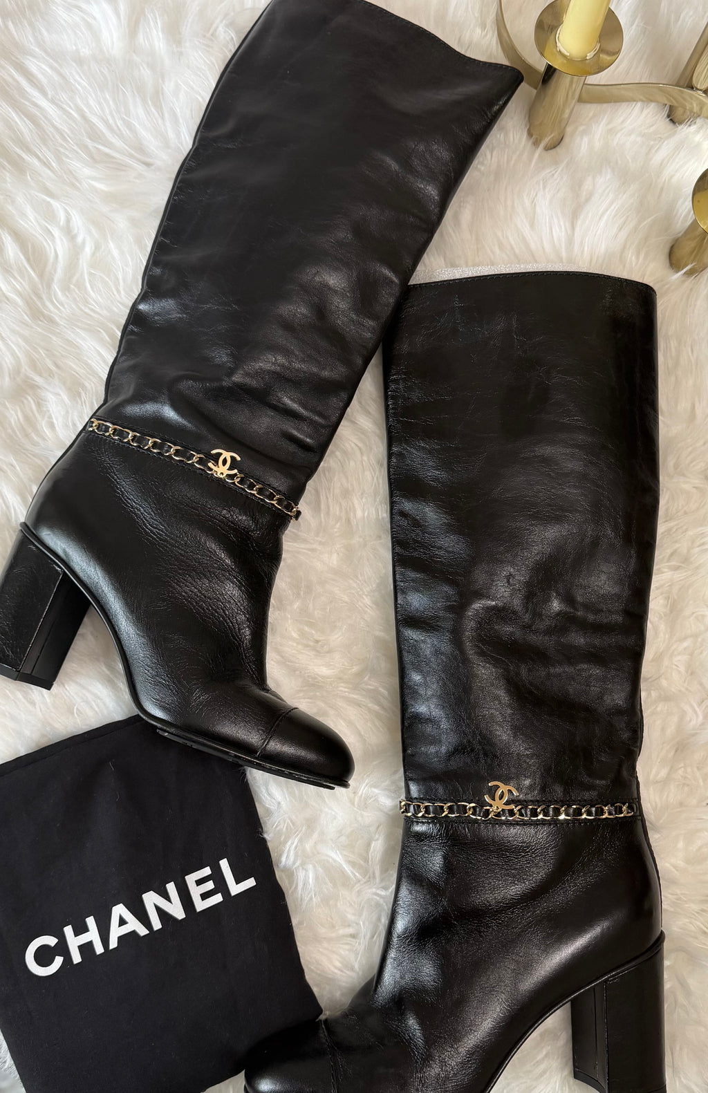 Chanel leather tall boots with a gold CC chain detail and block heel