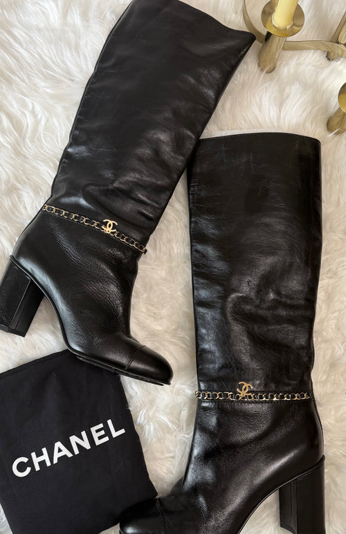 Chanel leather tall boots with a gold CC chain detail and block heel