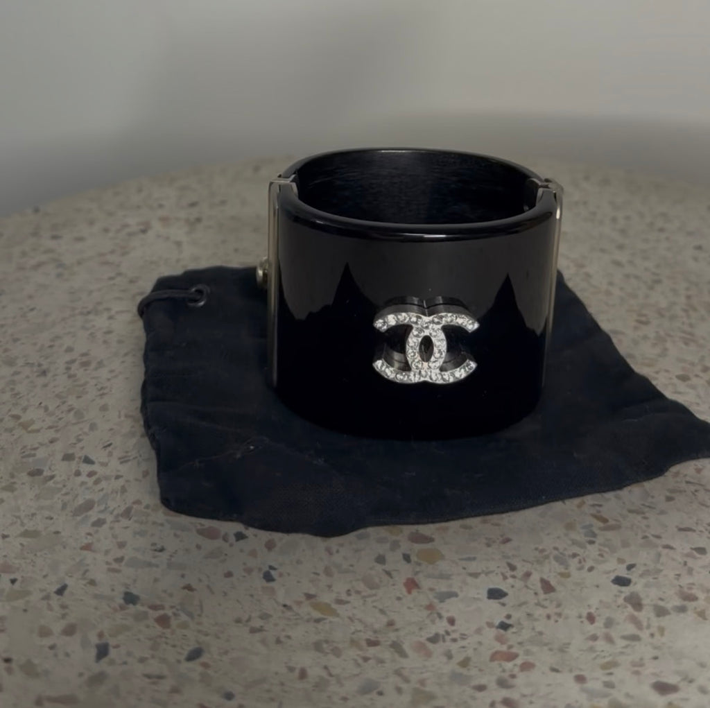 CHANEL BLACK RESIN AND CRYSTAL MOTIF WIDE CUFF BRACELET