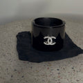 CHANEL BLACK RESIN AND CRYSTAL MOTIF WIDE CUFF BRACELET