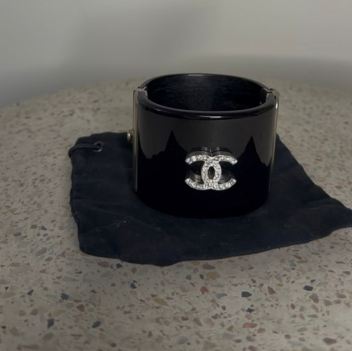 CHANEL BLACK RESIN AND CRYSTAL MOTIF WIDE CUFF BRACELET
